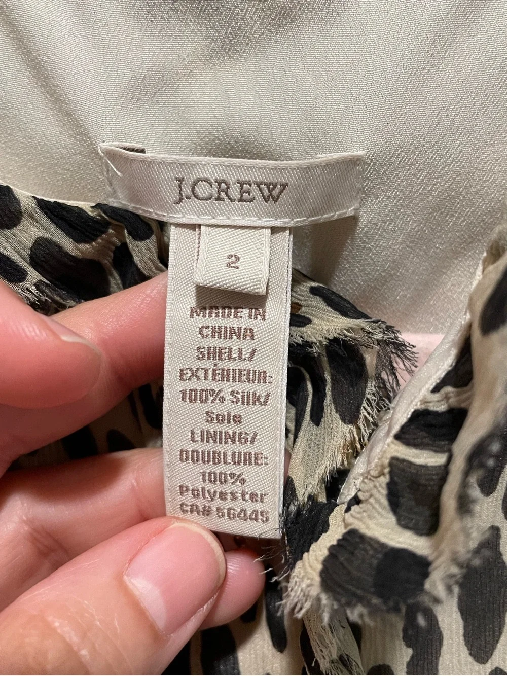 J.Crew silk blouse features a sleeveless design and a cheetah print. Size 2.